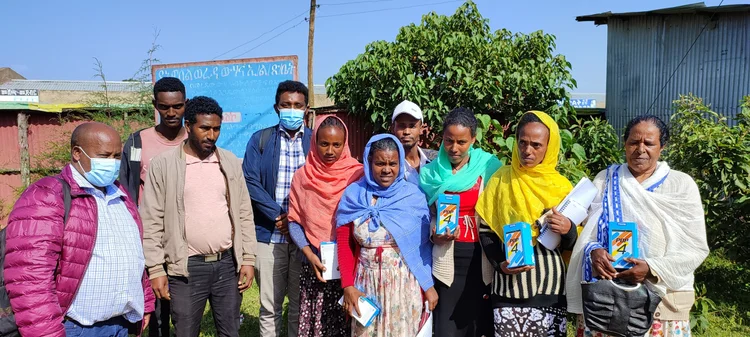 Group of Ethiopian beekeepers and project partners standing outside after a research session